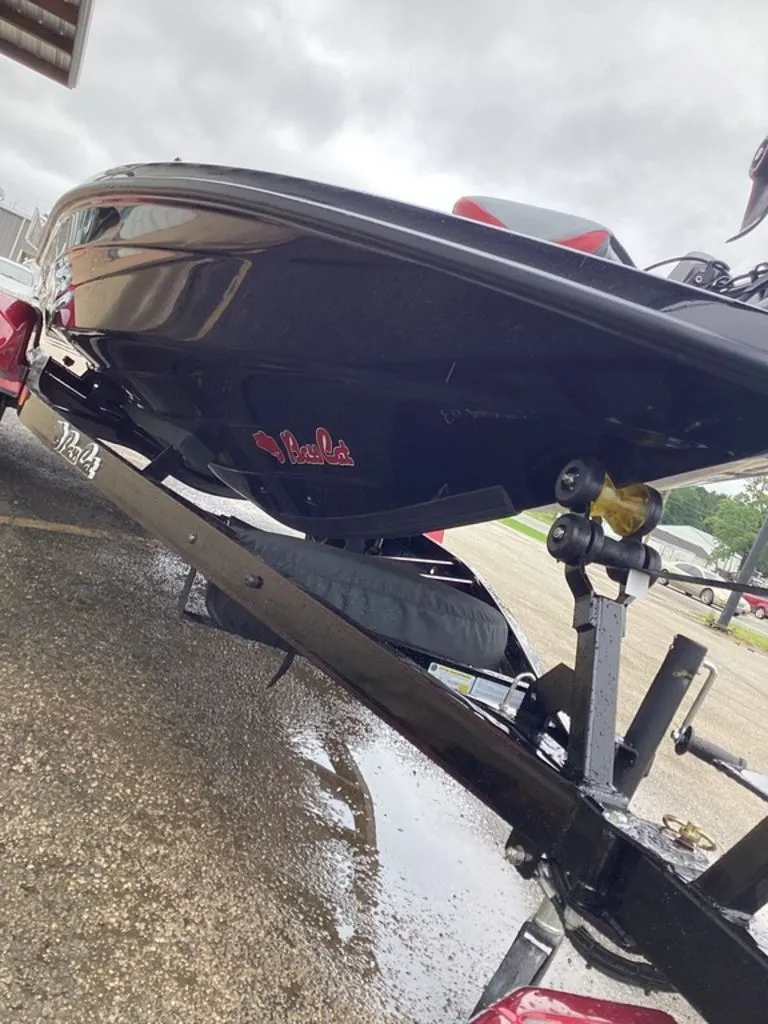 Slide: The Image of 2026 Bass Cat Eyra SP on trailer, side view. - 13
