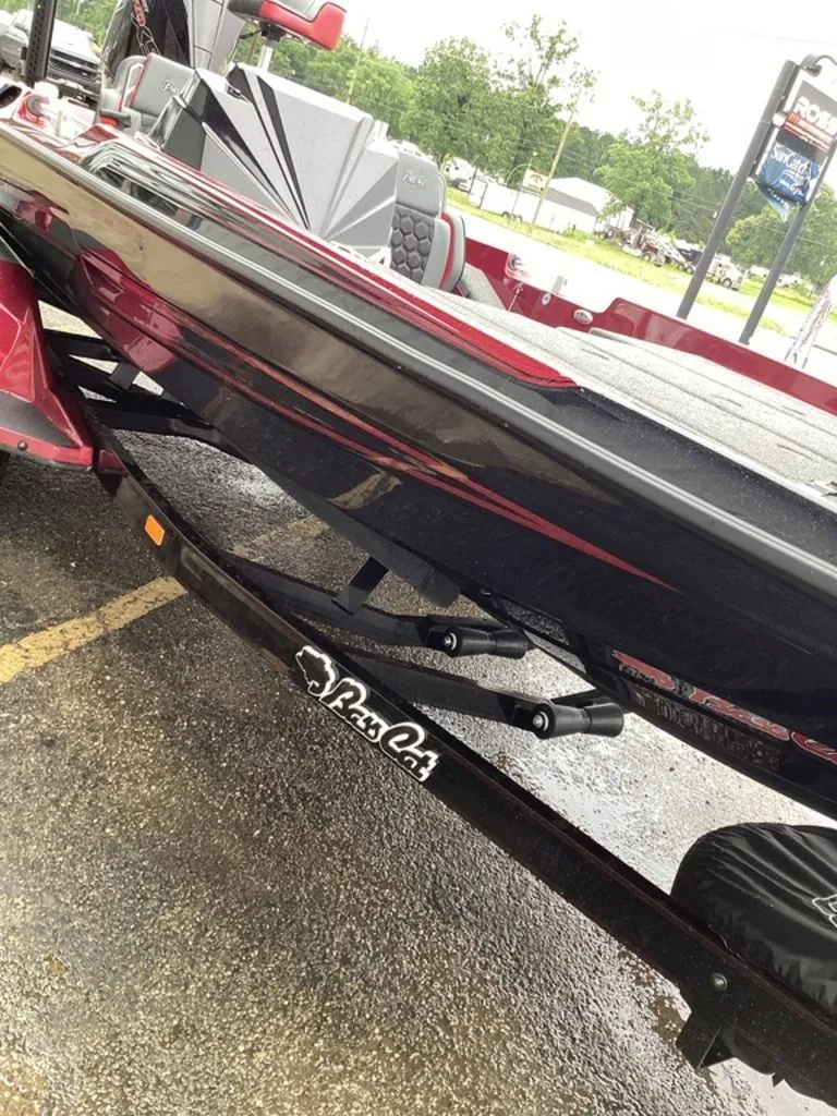 Slide: The Image of 2026 Bass Cat Eyra SP boat on trailer, close-up view. - 14
