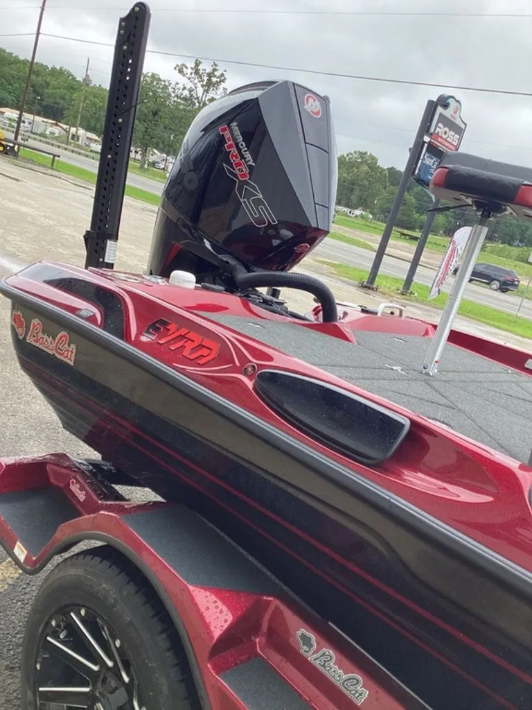Slide: The Image of 2026 Bass Cat Eyra SP boat with powerful outboard motor. - 18