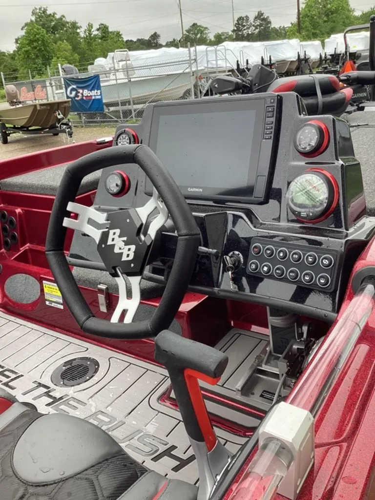 Slide: The Image of Interior view of 2026 Bass Cat Eyra SP boat with modern controls. - 19