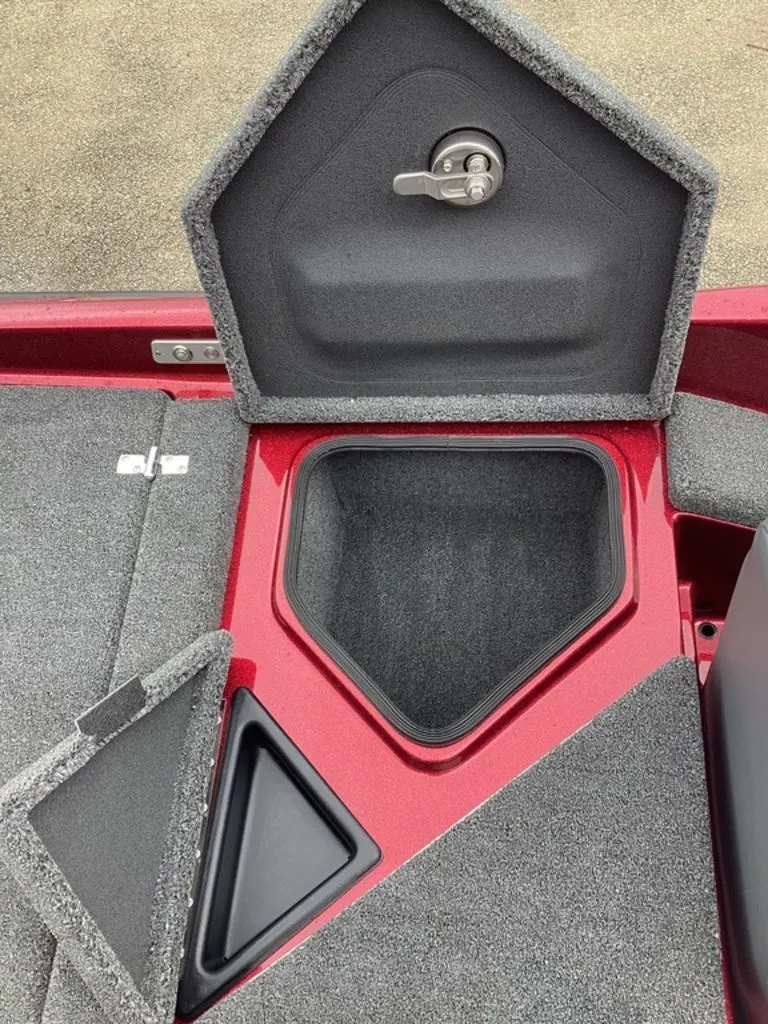 Slide: The Image of 2026 Bass Cat Eyra SP boat with open storage compartment. - 25