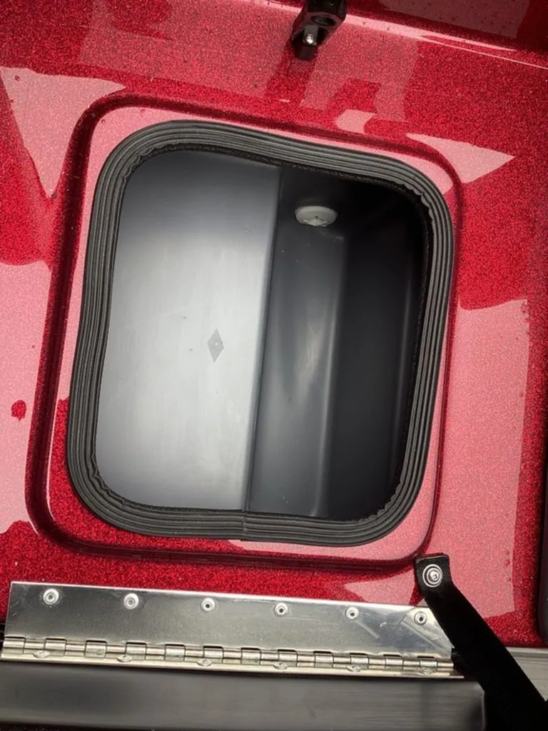 Slide: The Image of Bass Cat Eyra SP 2026 storage compartment with red finish. - 32