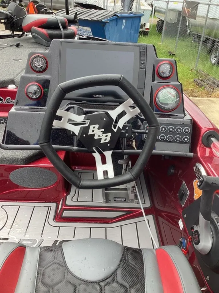 Slide: The Image of Interior view of 2026 Bass Cat Eyra SP boat with steering wheel and instruments. - 37