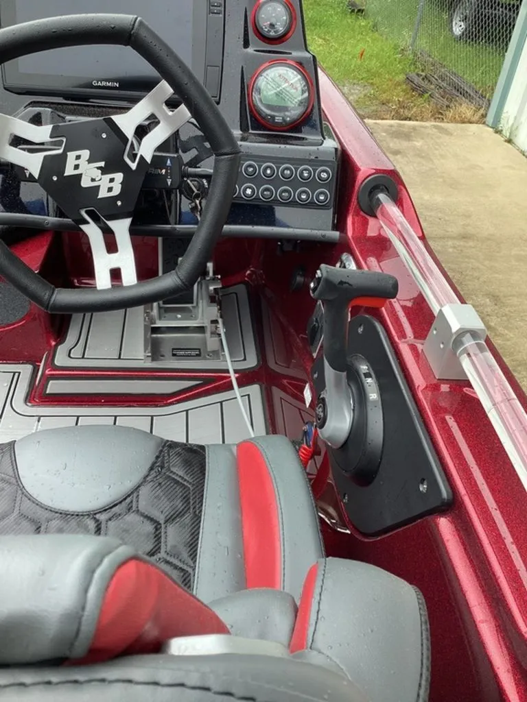 Slide: The Image of Interior of 2026 Bass Cat Eyra SP with steering and dashboard controls. - 38