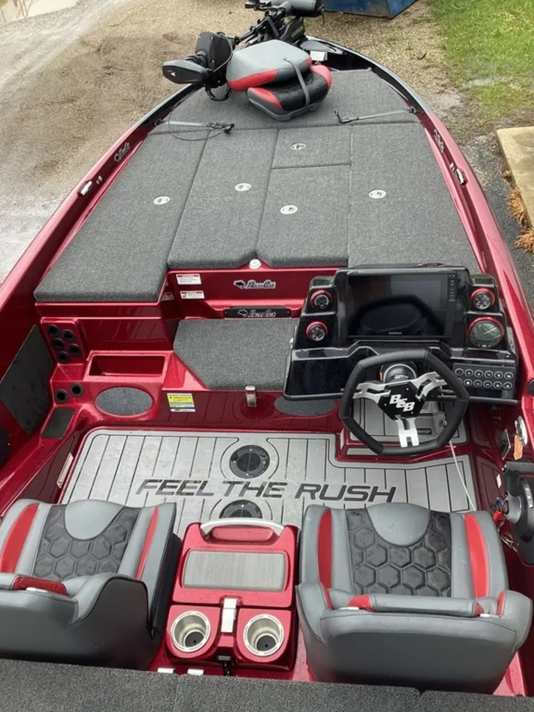 Slide: The Image of Interior of 2026 Bass Cat Eyra SP with gray seating and control console. - 39