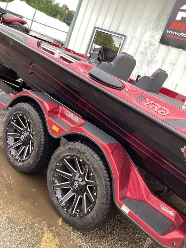 Slide: The Image of 2026 Bass Cat Eyra SP boat on red trailer. - 4