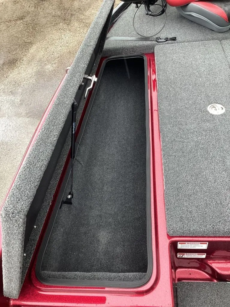 Slide: The Image of Bass Cat Eyra SP 2026 with open storage compartment on deck. - 43