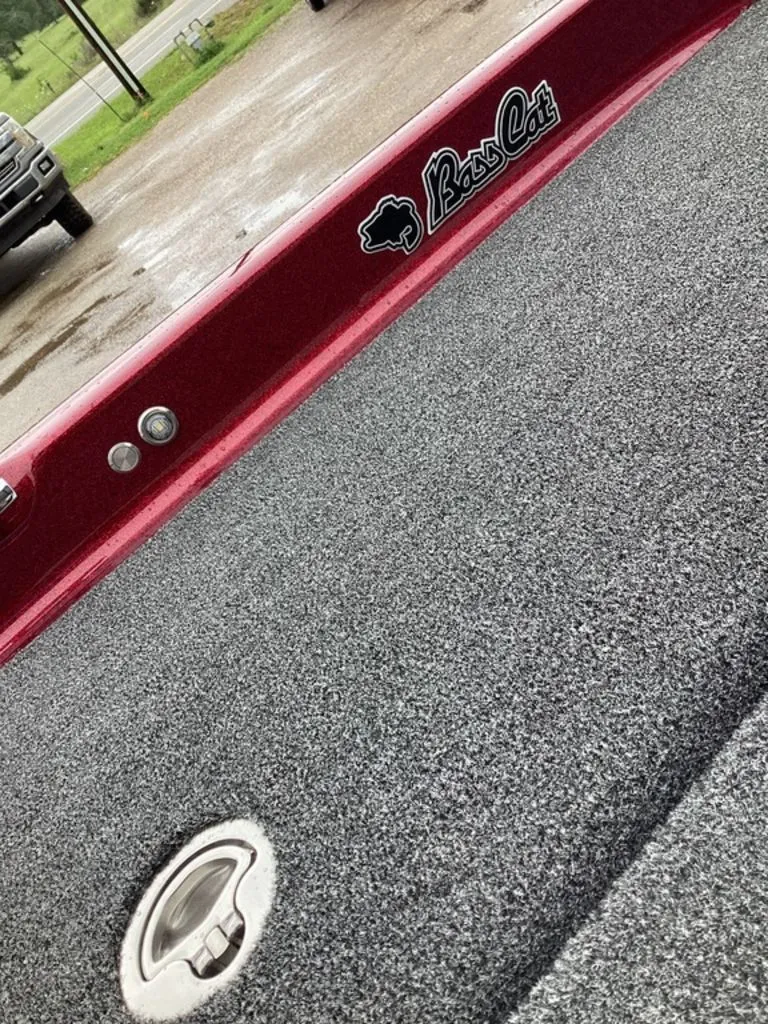 Slide: The Image of 2026 Bass Cat Eyra SP boat with gray carpet flooring. - 46