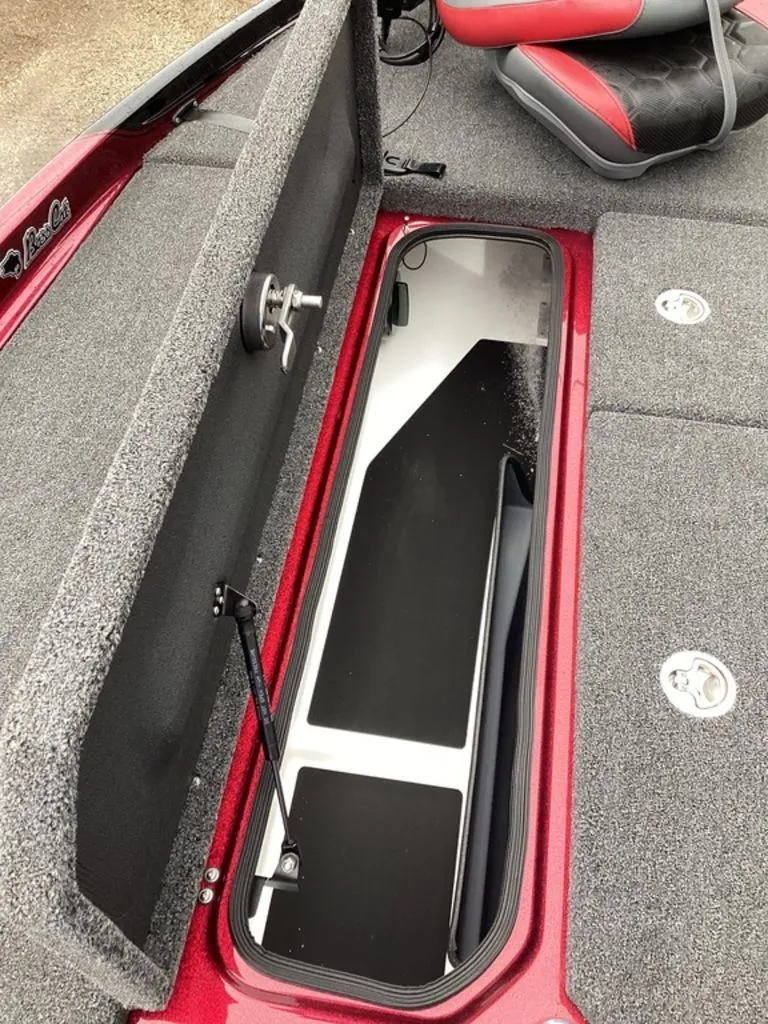 Slide: The Image of 2026 Bass Cat Eyra SP boat with open storage compartment. - 47