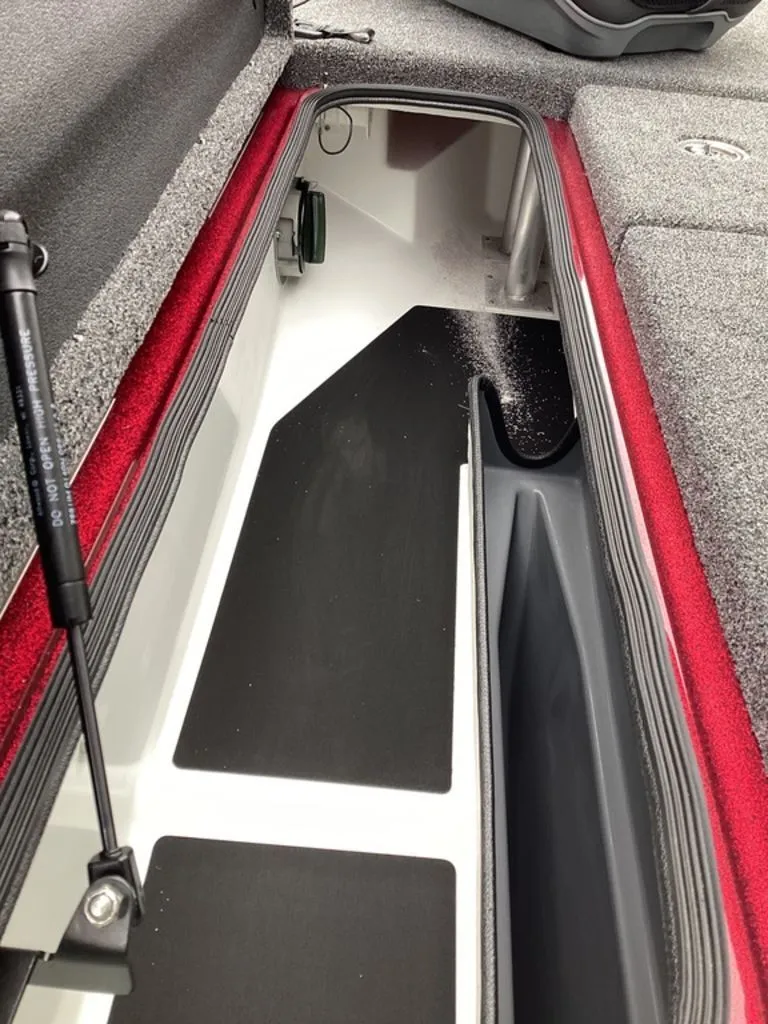 Slide: The Image of Interior view of 2026 Bass Cat Eyra SP boat storage compartment. - 49