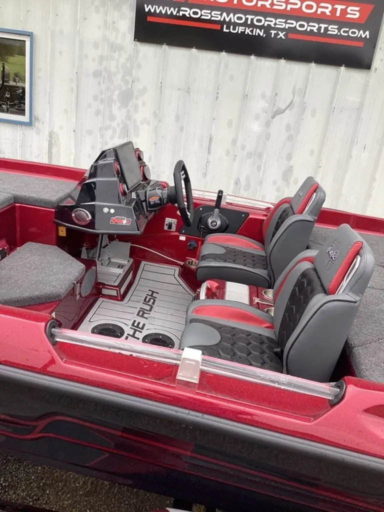 Slide: The Image of Interior of 2026 Bass Cat Eyra SP boat, red and gray seating. - 8