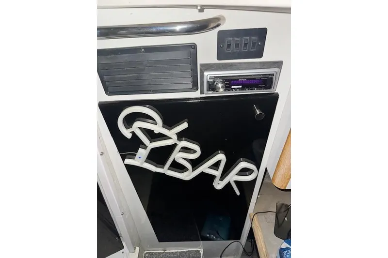Slide: The Image of 1995 Maxum 2700 SR boat interior with stereo and "BAR" neon sign. - 25