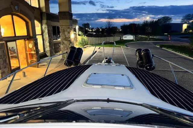 Slide: The Image of 1995 Maxum 2700 SR boat docked at sunset, showcasing sleek design and modern features. - 7