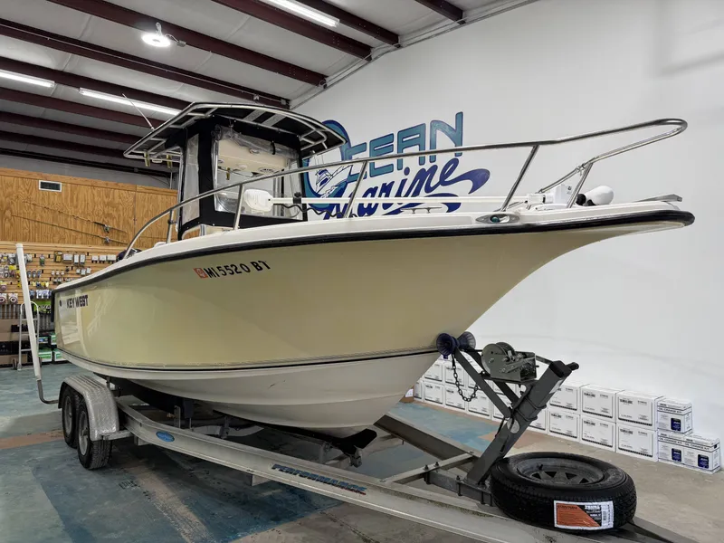 Slide: The Image of 2005 Key West 225 boat on trailer in warehouse. - 14