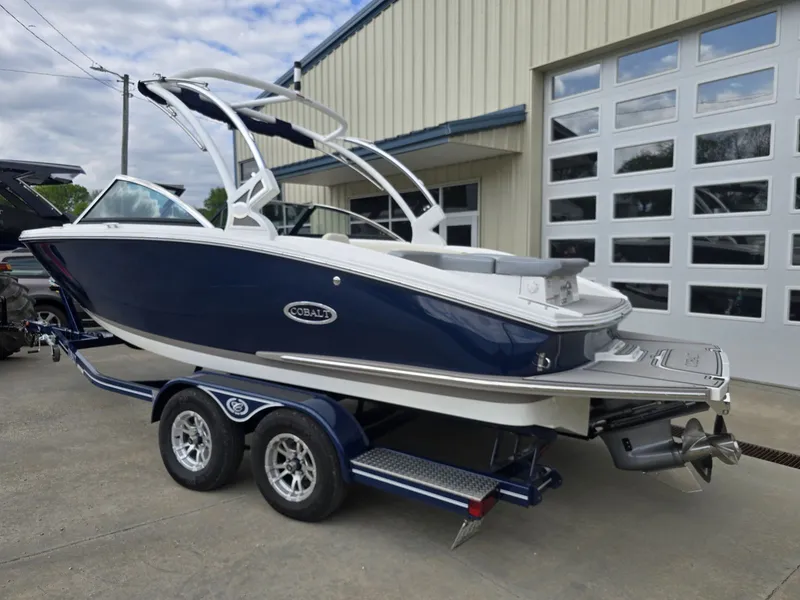 Slide: The Image of 2021 Cobalt CS22 boat on trailer in front of garage. - 5