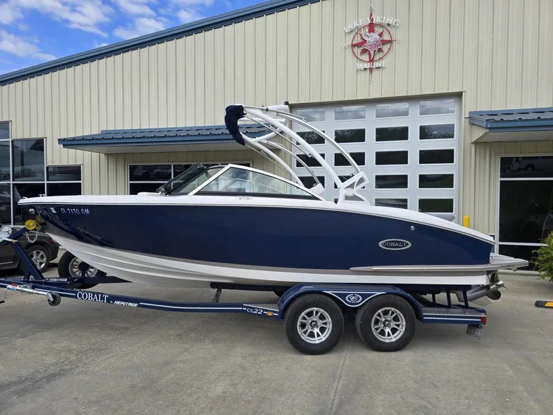 Slide: The Image of 2021 Cobalt CS22 boat on trailer in front of building. - 6