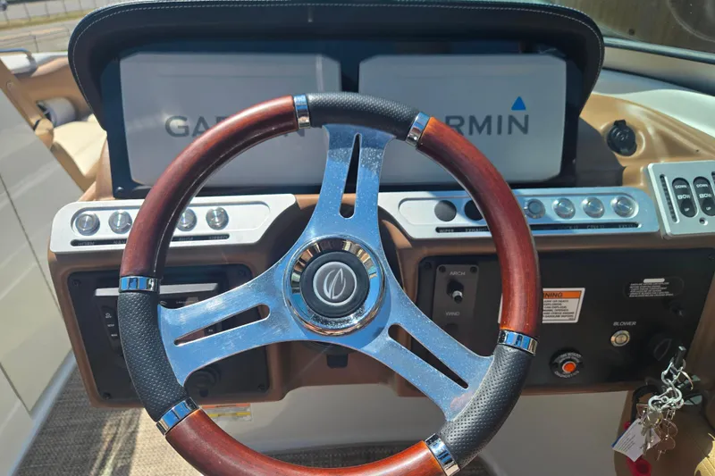 Slide: The Image of Steering wheel of 2021 Crownline Eclipse E235 boat with Garmin navigation system. - 16