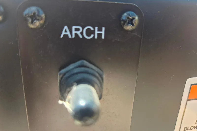 Slide: The Image of Switch labeled "ARCH" on 2021 Crownline Eclipse E235 boat dashboard. - 22