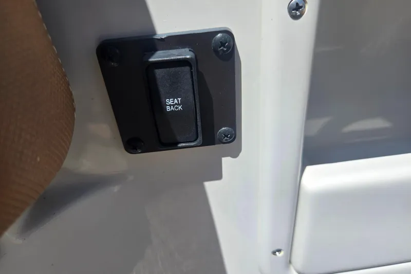 Slide: The Image of Seat back switch on 2021 Crownline Eclipse E235 boat interior. - 24