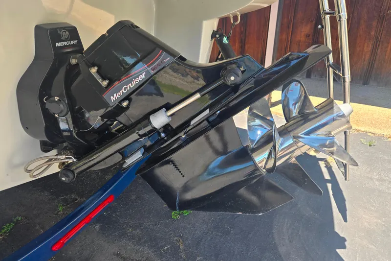 Slide: The Image of 2021 Crownline Eclipse E235 with MerCruiser Bravo Three outdrive and stainless steel propellers. - 5