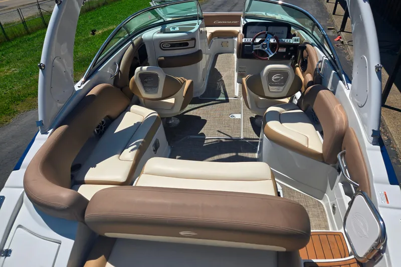 Slide: The Image of 2021 Crownline Eclipse E235 boat interior with luxurious seating and modern dashboard. - 7