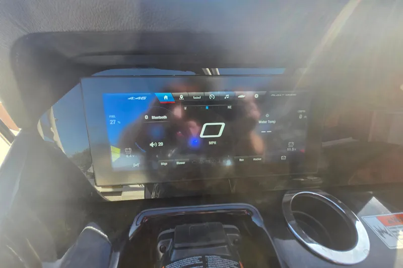 Slide: The Image of Dashboard of 2022 Yamaha Boats 212SD displaying speed, Bluetooth, and water temperature. - 14