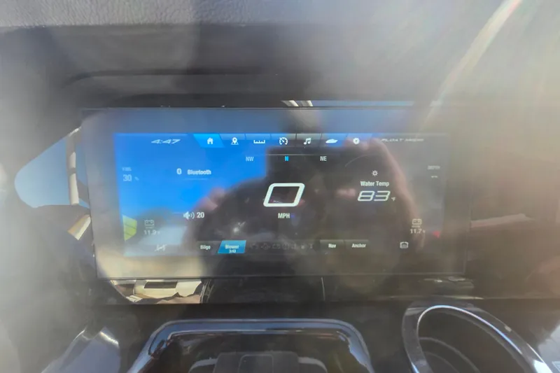 Slide: The Image of Dashboard display of a 2022 Yamaha Boats 212SD, showing speed and water temperature. - 15