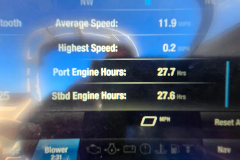 Slide: The Image of Dashboard display of a 2022 Yamaha Boats 212SD showing engine hours and speed metrics. - 16