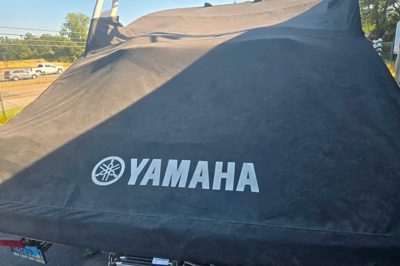 Slide: The Image of Covered 2022 Yamaha Boats 212SD with logo visible outdoors. - 17