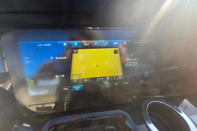 Slide: The Image of Dashboard of 2022 Yamaha Boats 212SD showing navigation and system information. - 18