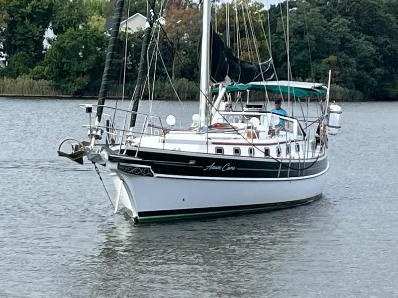 Slide: The Image of Sailing yacht Gozzard 44 AC, 1996 model, cruising on a calm river. - 2