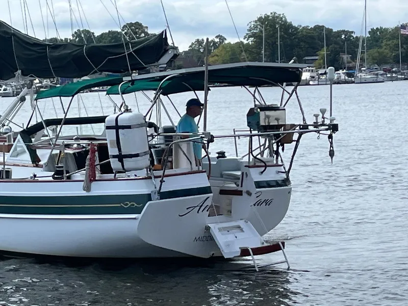 Slide: The Image of Gozzard 44 AC sailboat from 1996 docked on a calm lake. - 3