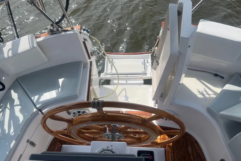 Slide: The Image of Cockpit of 1996 Gozzard 44 AC sailboat with wooden steering wheel and seating. - 5