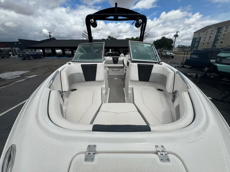 Slide: The Image of Interior view of 2021 Chaparral Surf 21 boat with white seating. - 13