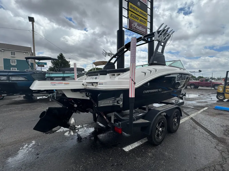 Slide: The Image of 2021 Chaparral Surf 21 boat parked on trailer outdoors. - 3