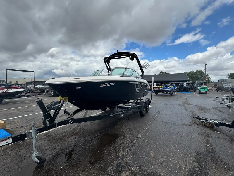 Slide: The Image of 2021 Chaparral Surf 21 boat on trailer under cloudy sky. - 5