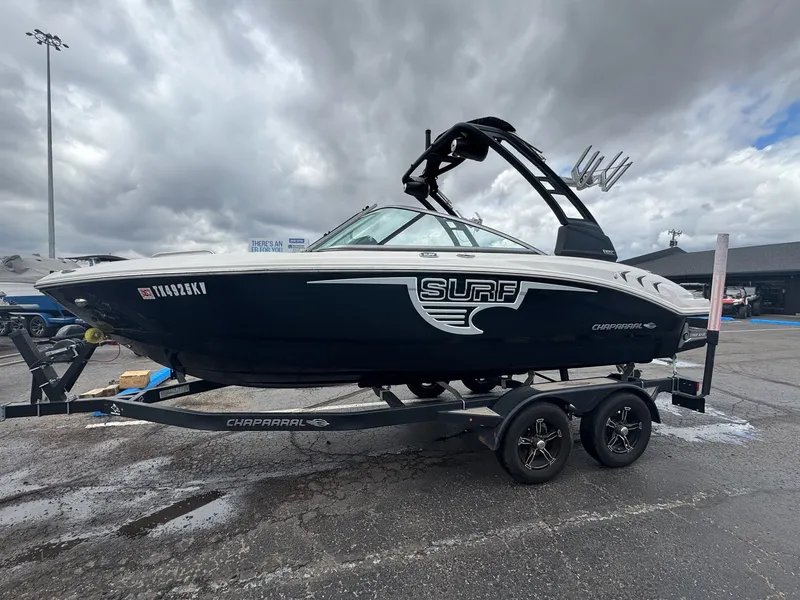 Slide: The Image of 2021 Chaparral Surf 21 boat on trailer under cloudy sky. - 6