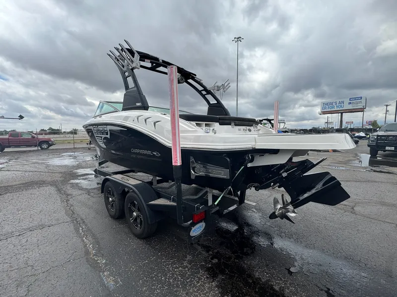 Slide: The Image of 2021 Chaparral Surf 21 boat on trailer under cloudy sky. - 7