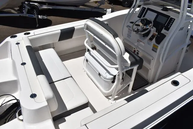 Slide: The Image of Interior of 2023 Robalo R202 Explorer with helm console and seating area. - 11