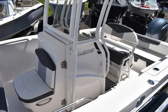 Slide: The Image of 2023 Robalo R202 Explorer boat interior with seating area. - 19