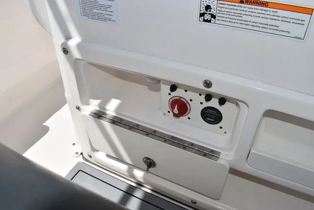 Slide: The Image of Control panel of 2023 Robalo R202 Explorer with switches. - 34