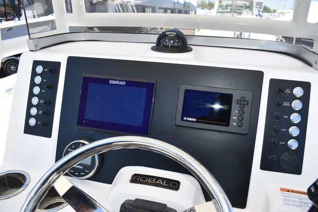 Slide: The Image of Dashboard of 2023 Robalo R202 Explorer with Simrad and Yamaha displays. - 39