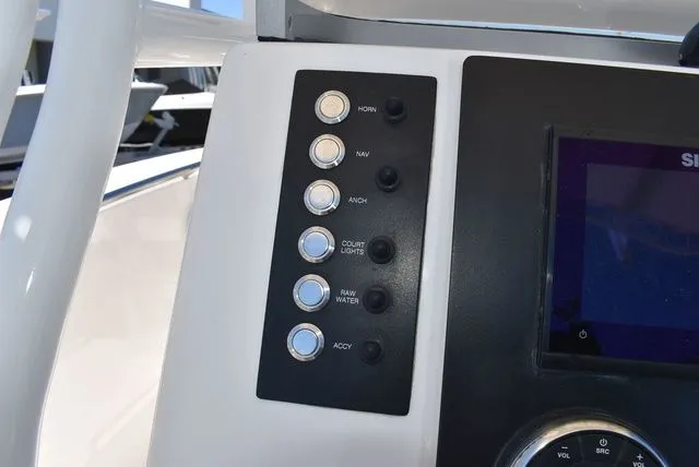 Slide: The Image of Control panel of 2023 Robalo R202 Explorer with switches. - 41