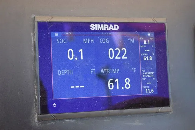 Slide: The Image of Simrad display on 2023 Robalo R202 Explorer showing speed and water temperature. - 49