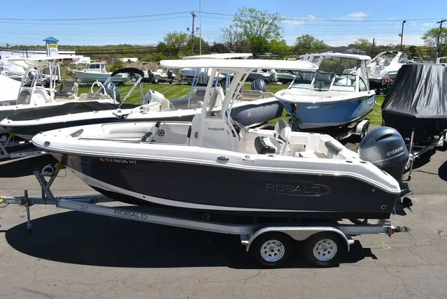 Slide: The Image of 2023 Robalo R202 Explorer boat on trailer outdoors. - 5