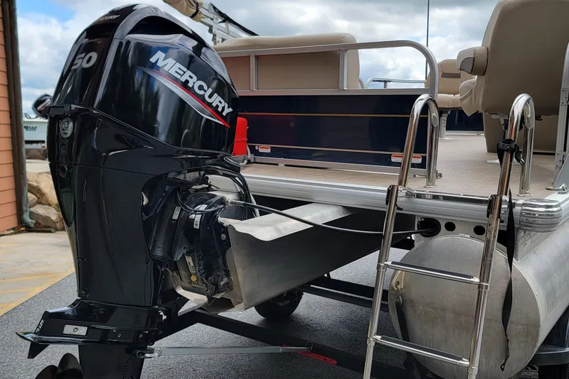 Slide: The Image of 2024 Sun Tracker Bass Buggy 16 XL Select with Mercury outboard motor and ladder. - 3
