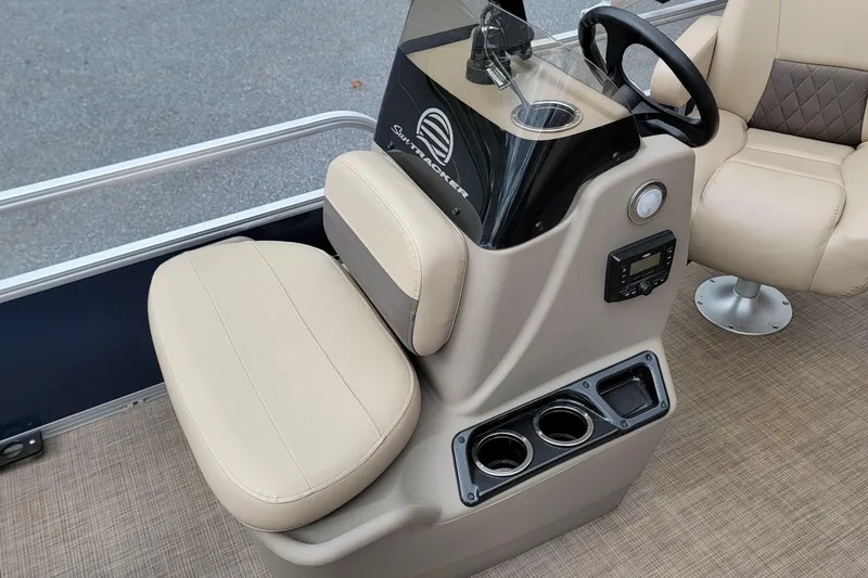 Slide: The Image of 2024 Sun Tracker Bass Buggy 16 XL Select boat interior with steering console and seating. - 9