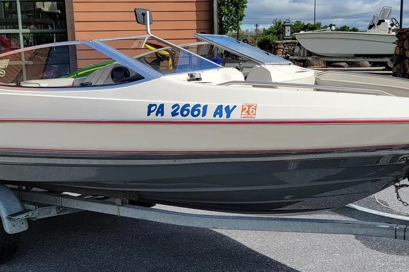 Slide: The Image of 1990 Bayliner 1850 Capri boat on trailer, registration PA 2661 AY visible. - 4
