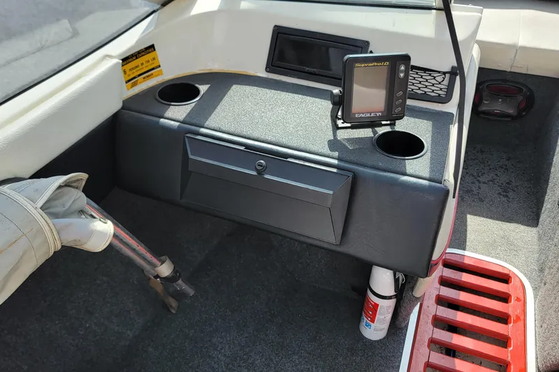 Slide: The Image of Interior of a 1990 Bayliner 1850 Capri boat with dashboard and fish finder. - 8