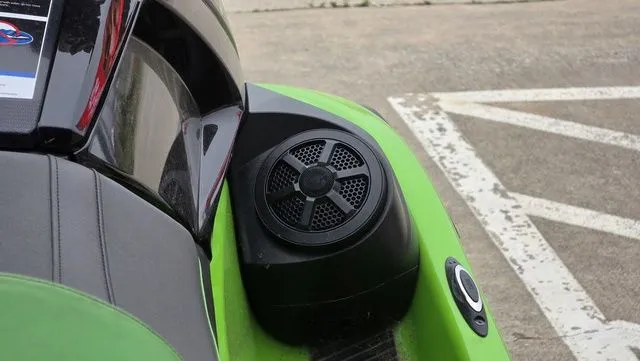 Slide: The Image of Yamaha WaveRunner VX1800B-WB 2021 with speaker on green seat. - 13